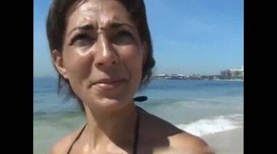 Tanned cougar was picked up on a public beach for kinky sex and a facial - Germany - Brazil on badgirlnextdoor.com
