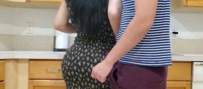 Voluptuous mommy is banged by her randy stepson in the kitchen while making dinner on badgirlnextdoor.com