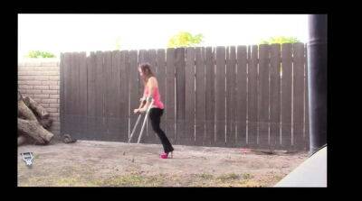 Amputee Brittney using high heel and crutch on badgirlnextdoor.com