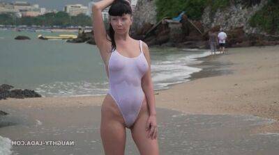 Naughty Russian MILF in White see thru swimsuit outdoors in public resort - Russia on badgirlnextdoor.com