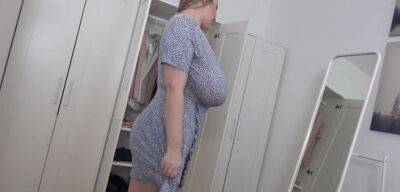 BBW blonde reveals her giant jugs while undressing on badgirlnextdoor.com