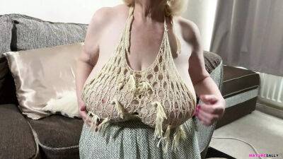 Mature Sally's huge tits in a skimpy top which leaves nothing to the imagination on badgirlnextdoor.com