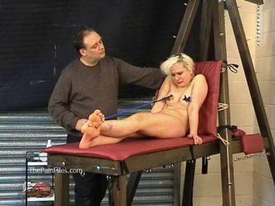 Busty blonde is punished with hot wax and hard spanking on badgirlnextdoor.com